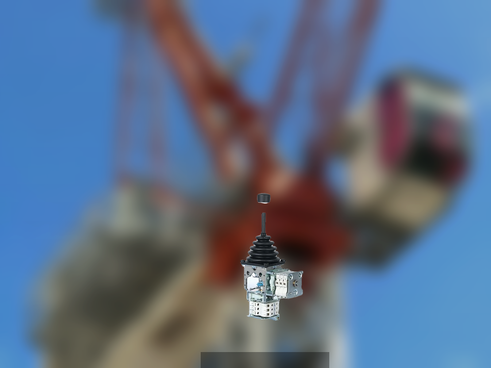 Multi-Axis Industrial Joystick for Crane Control 1 Trunsin AT16 multi-axis joystick on tower crane cab background — crane control layout