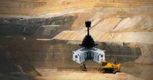Open-pit mine with yellow excavator — mining cabin industrial joystick application environment