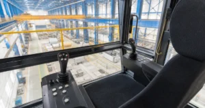 KST crane control joystick — chair-mounted multi-axis masters in crane pulpit