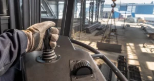 Hoist console with fingertip industrial controller and thumbwheel for fine inching